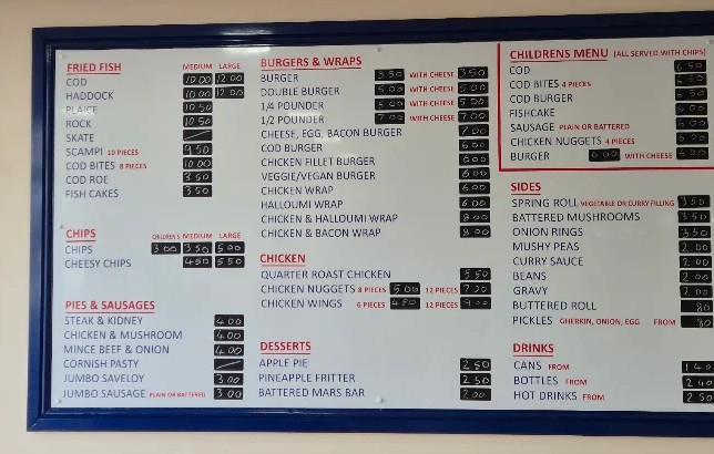 Danny’s fish and chips menu board: fried fish, chips, pies, burgers, children’s meals, sides and drinks.